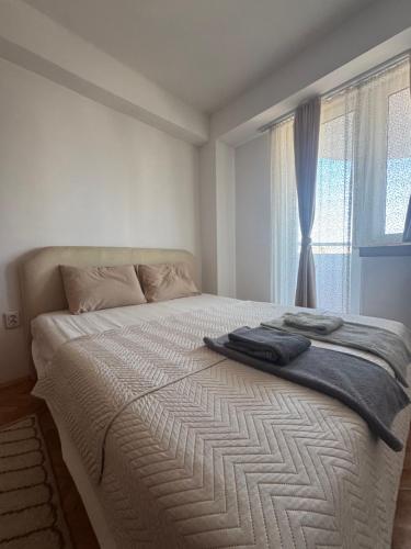 Llit o llits en una habitació de Alex Apartment