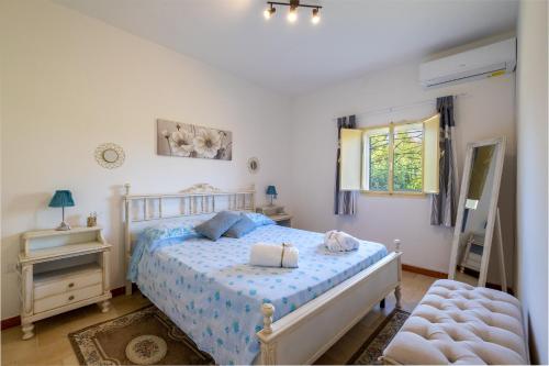 En eller flere senge i et værelse på Villa Grazia