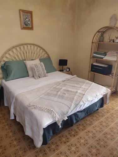 Ένα ή περισσότερα κρεβάτια σε δωμάτιο στο Il Nido Karino