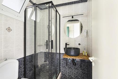 a bathroom with a sink and a shower at Sunset Premium Studio D in Agios Nikitas