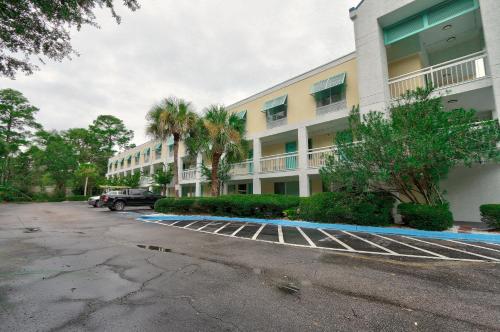 a parking lot in front of a building at Hotel Carolina - Double Room 2 Full Beds in Hilton Head Island