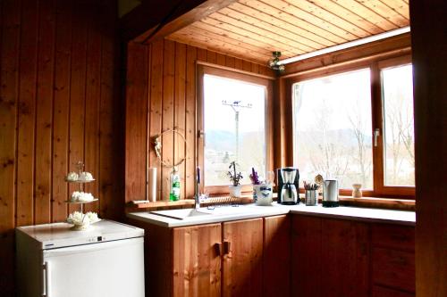 a kitchen with a sink and a window at Wohnen im schönen Bauernhaus in Beckingen