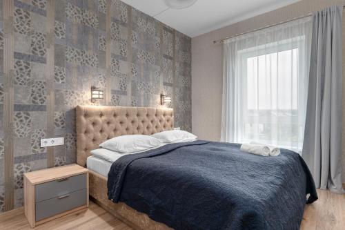 Postel nebo postele na pokoji v ubytování Cozy One-Bedroom Retreat in Klaipėda I Cohost