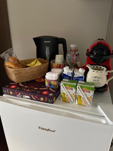 a white refrigerator with food on top of it at Dimora La Gravina in Matera