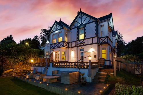 a large house with a deck at night at NORTHRISE RETREAT in Hastings