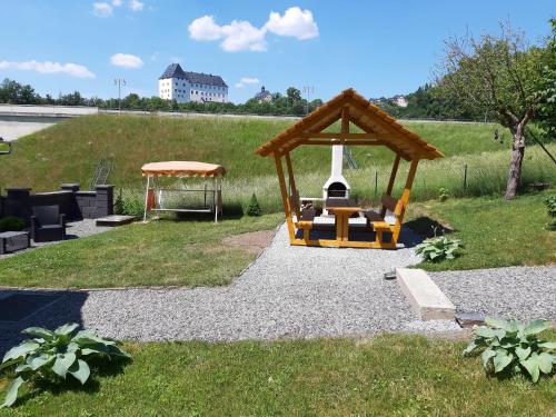 a playground with a gazebo in a yard at Schlossblick keine Montagewohnung in Burgkhammer