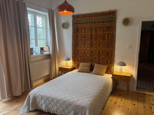 Postel nebo postele na pokoji v ubytování Apartament przy księgarni