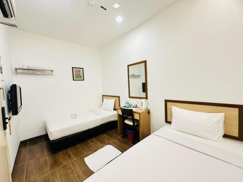 Postel nebo postele na pokoji v ubytování Hotel Sunflower - HLS