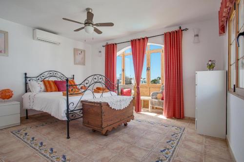 a bedroom with a bed and a window at Villa Lea in Puerto del Carmen