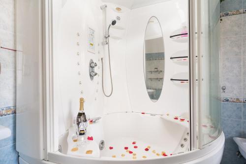 a bathroom with a tub with a surfboard in it at Casa Vacanza Cala Luna in Orosei