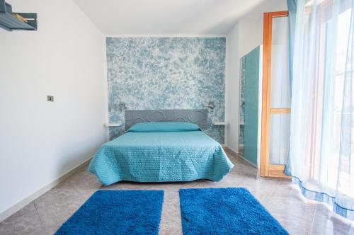 Cama o camas de una habitación en Le Cromie Catignano