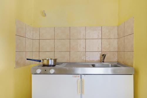 a kitchen sink with a pot on top of it at Diamerima 2ari A in Nydri