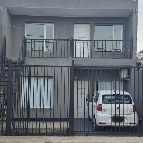 a white van parked in front of a building at Delvi Nelly - Belgrano in Neuquén