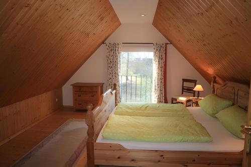 Una cama o camas en una habitación de Gänsehaus