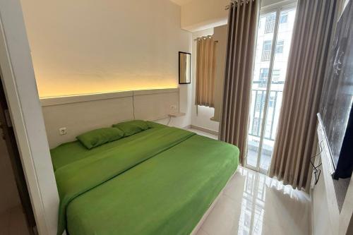 Ένα ή περισσότερα κρεβάτια σε δωμάτιο στο Serpong Garden NATURE INN