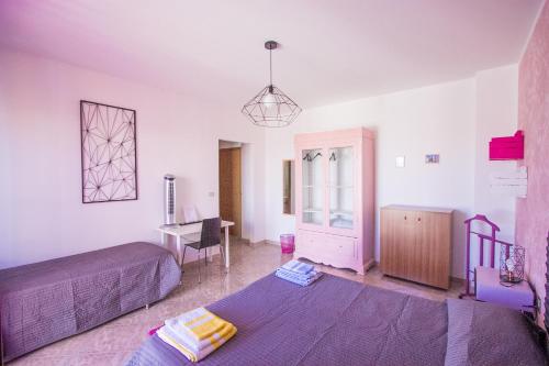 Cama o camas de una habitación en Le Cromie Catignano