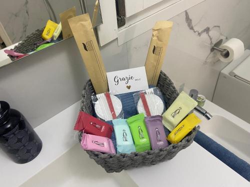 a basket on a counter with different colored items in it at B&B Kira Home in La Mura