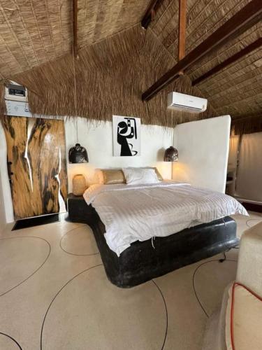 a bedroom with a large bed in a room at Happy Coco Monkey - Cozy Studio by SP Villa in Ko Phangan