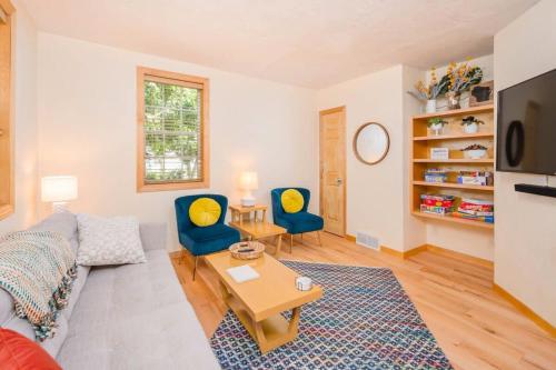 a living room with a couch and two chairs at Downtown 2BR Home - Lawrence University College Ave in Appleton