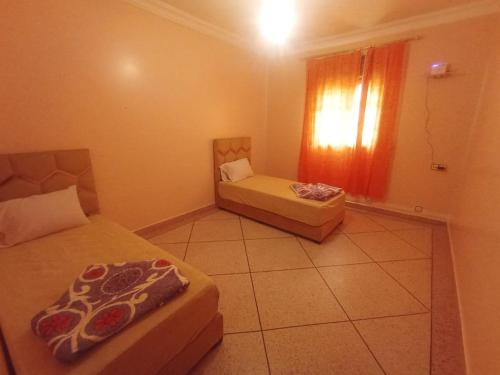 Giường trong phòng chung tại Calme House Quiet & close to all necessities