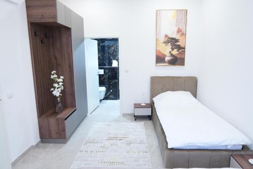 Ένα ή περισσότερα κρεβάτια σε δωμάτιο στο Wohnung IC - Luxus-Apartment mit Elegantem Design