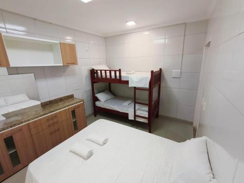 Ένα ή περισσότερα κρεβάτια σε δωμάτιο στο Essenza Suites Natal