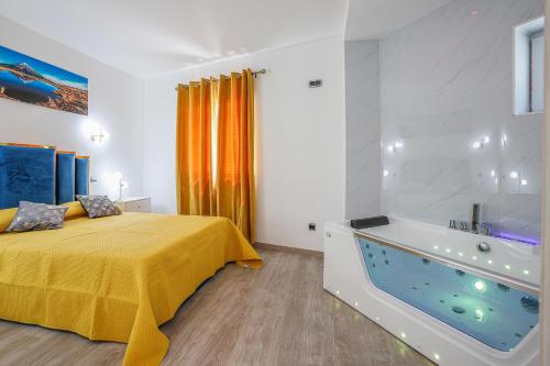 a bedroom with a bed and a bath tub at Refúgio da Raia in Melgaço