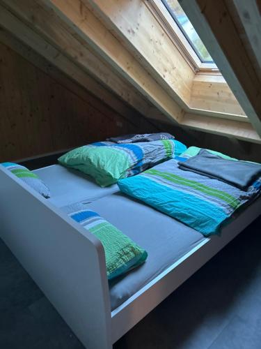 two beds in the attic of a tiny house at Holzliebe mit Donaublick in Kaisheim
