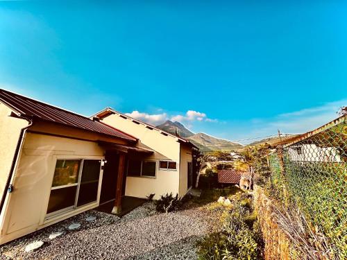 a small house with a fence next to it at Takemi no Yado - Vacation STAY 97130v in Yufuin