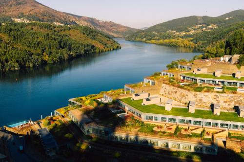 an aerial view of a river with mountains in the background at Octant Douro in Castelo de Paiva