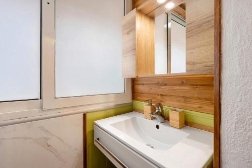 a bathroom with a sink and a mirror at Casa Nonno Enzo in Genova