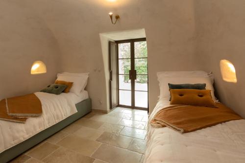 Postel nebo postele na pokoji v ubytování Villa Acquamarina - Puglia Luxury Homes