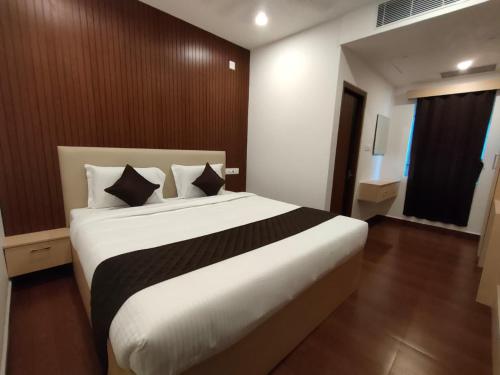 Postel nebo postele na pokoji v ubytování Neo Elite Inn