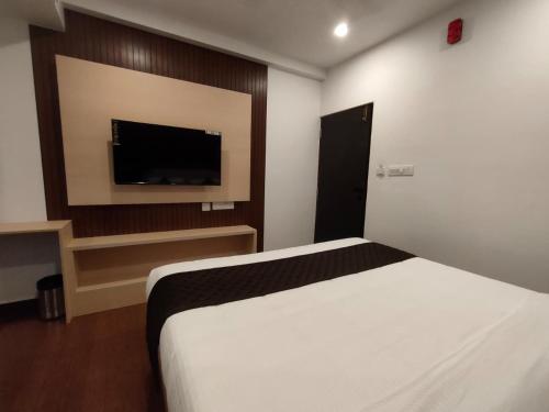 TV a/nebo společenská místnost v ubytování Neo Elite Inn