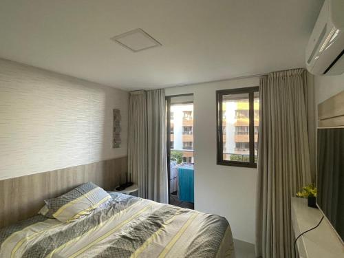 Un pat sau paturi într-o cameră la Atlantic Paradise