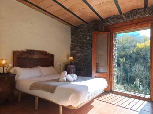 Postel nebo postele na pokoji v ubytování Allotjaments Cal Llarg