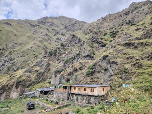 a building on the side of a mountain at Fortress House Khakhabo in Khakhabo