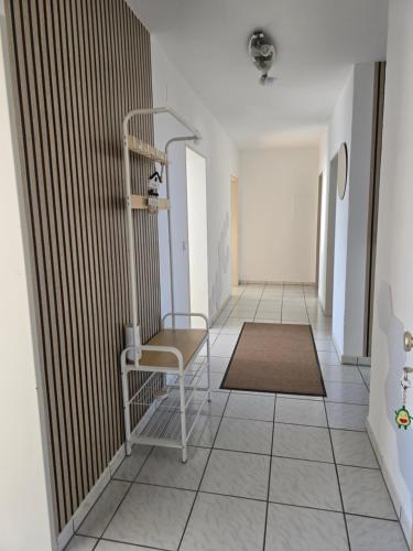 a hallway with a chair and a rug at Ferienwohnung Weitblick in Dachau