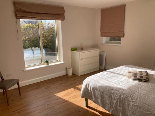 Ένα ή περισσότερα κρεβάτια σε δωμάτιο στο Circular Road Comfort - UHG & University Access