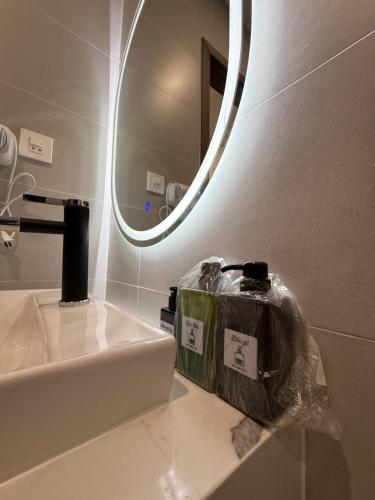 a bathroom with a sink and a mirror at Town House for rent in Thủ Đức in Ho Chi Minh City