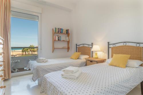 Katil atau katil-katil dalam bilik di Casa Del Mar