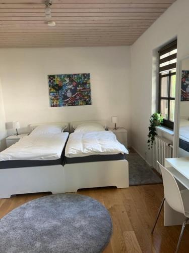 Postel nebo postele na pokoji v ubytování Fachwerkhaus im historischen Innenhof von Haus Im Turm