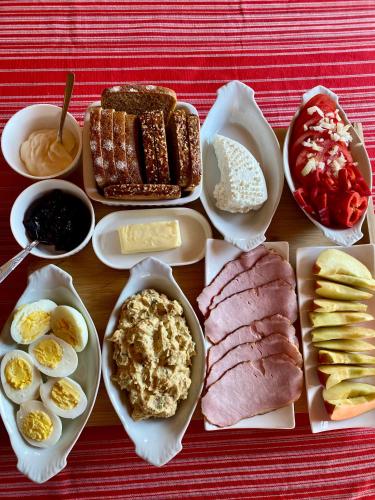 a tray of food with different types of breakfast foods at Lipowe Zapłocie in Czeremcha