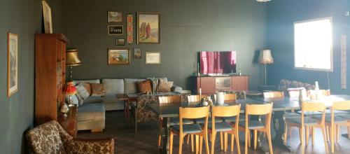 a living room with a table and chairs and a couch at Renovated Chapel With Fjord Views In Vågstranda in Reistad