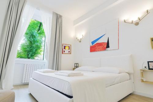 Postel nebo postele na pokoji v ubytování LikeHome Milano - Via Crema