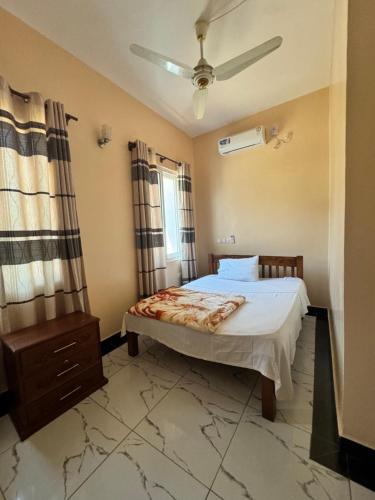 a bedroom with a bed and a window at Shuja Ranches in Kilifi