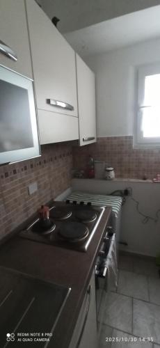 a kitchen with a sink and a stove top oven at Appartamento Bisa Queen in Bisacquino