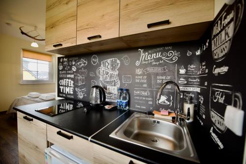 Kuchyň nebo kuchyňský kout v ubytování Šv Hubertas