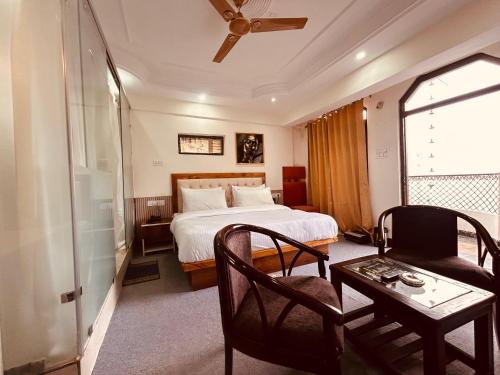 A bed or beds in a room at Quiet Edge Resort A Luxury Room With Balcony By Anvi Retreat