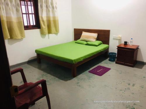 Postel nebo postele na pokoji v ubytování Nadee Guest & Yala Safari